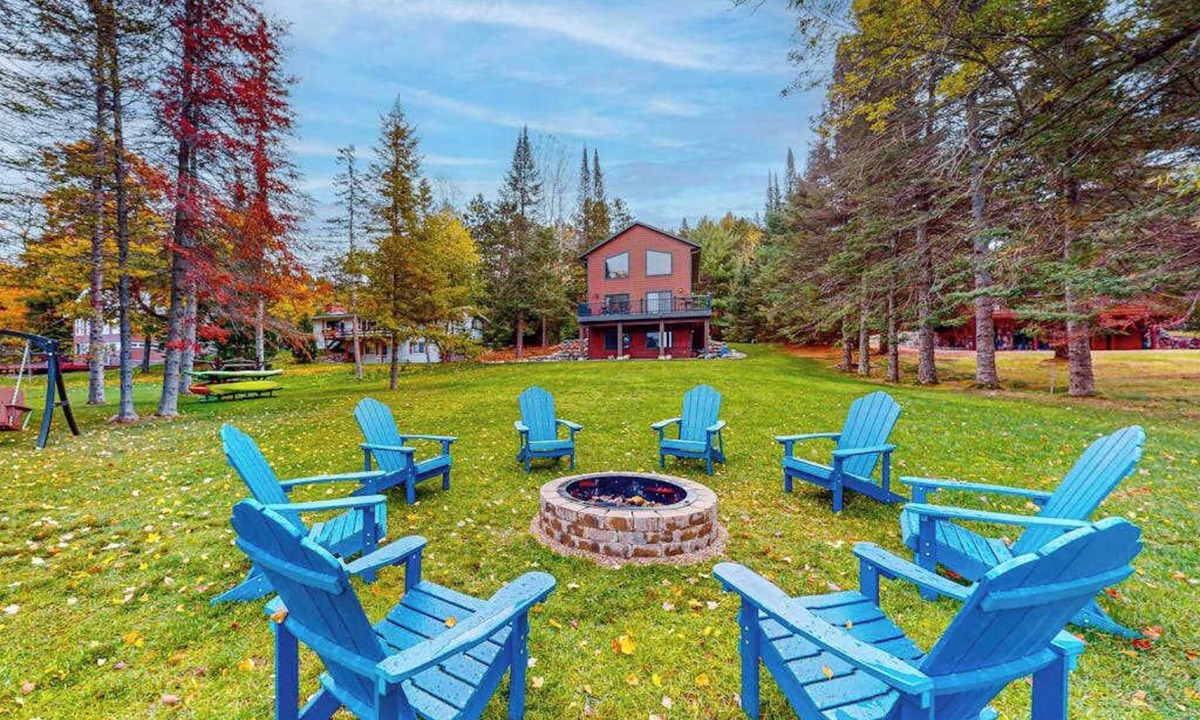 Eagle River House | Lakefront home with yard, private dock, deck, firepit, & washer/dryer