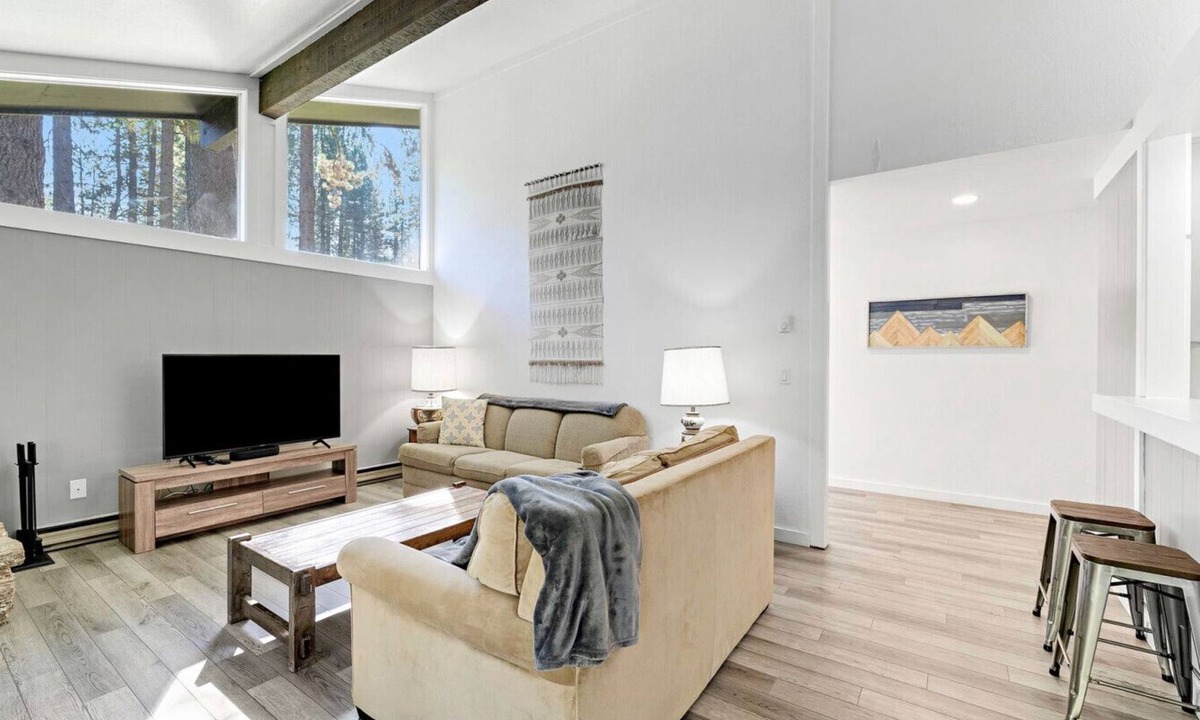 Graeagle Condo | This light-filled alpine retreat blends rustic charm with modern style.