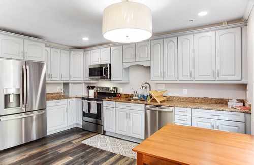 Edgewater House | 2-story, riverfront home with private dock, inviting deck & dog-friendly yard