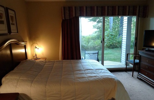 Acme Condo | Beachfront Condo has jacuzzi, 2 bathrms, kitchen, living room, bedroom & patio.