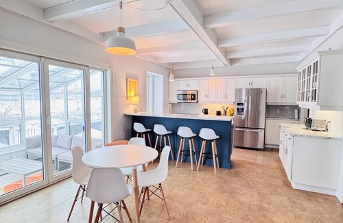 Antigonish House | Charming Sunroom Home with Cozy Living Spaces