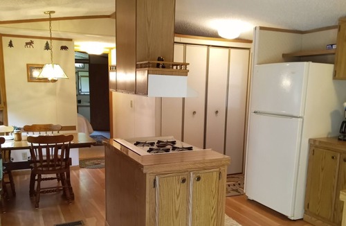 Manistique House | Cozy accommodations on Indian Lake with small sand beach.