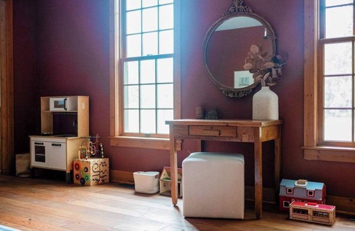 Maple City House | Exquisite Cape Cod home with large yard, fireplace, central AC, & W/D