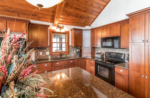 Conover House | Lakefront dog-friendly home with firepit, play set, dock, & beach access