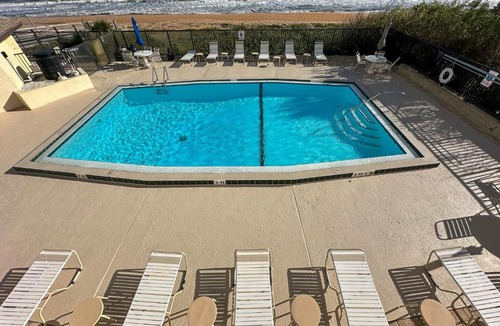 Ormond-by-the-Sea Apartment | New listing! Updated oceanfront 2-2 with private balcony, heated pool, and garage parking