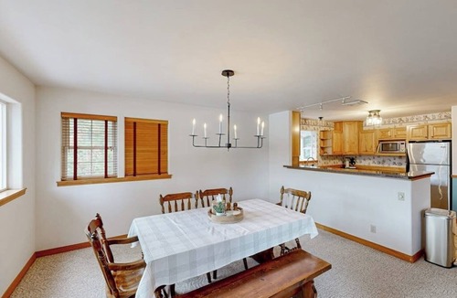 Sandpoint Cabin | Riverfront home with mountain view, hot tub, deck, WiFi, W/D, & fireplace