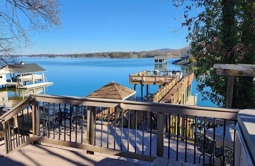 Penhook House | Stunning lake front with private dock and pontoon boat available for rent
