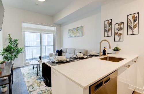 Kitchener House | Stylish Downtown Suite with Patio & City Views